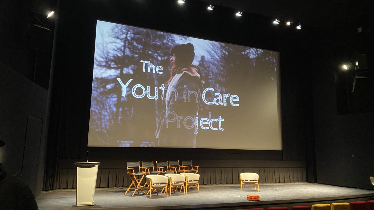 The Youth in Care Project title projected on the cinema screen
